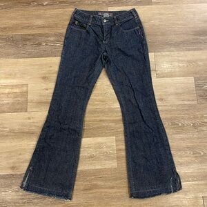 Women’s SILVER JEANS in dark blue with gold stitching.